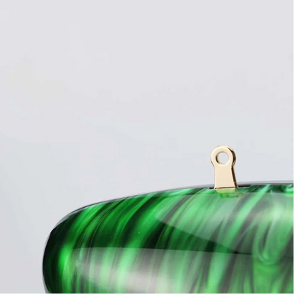 Vibrant green seashell clutch bag with a dreamy pearl acrylic finish, gold hasp closure, and chain strap – perfect for weddings, soirées, and beachside style by Montipi Australia