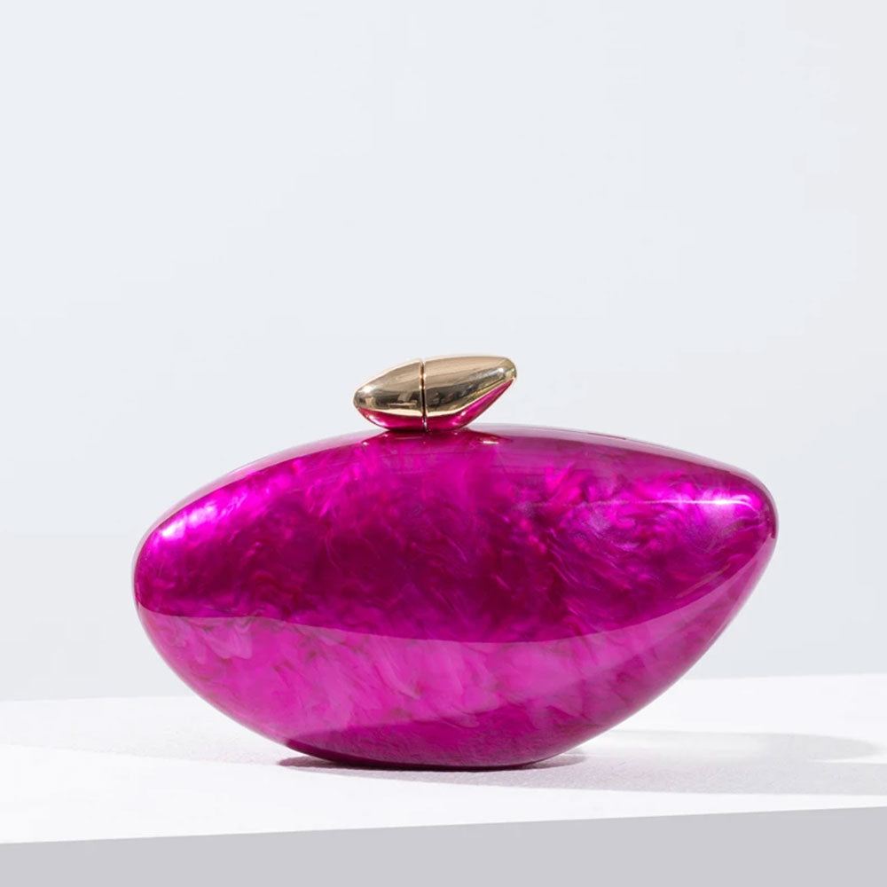 Hot pink seashell clutch bag with a dreamy pearl acrylic finish, gold hasp closure, and chain strap – perfect for weddings, soirées, and beachside style by Montipi Australia