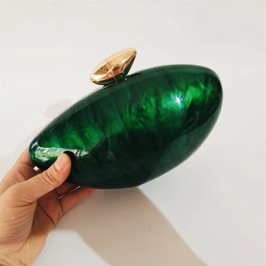 Vibrant green seashell clutch bag with a dreamy pearl acrylic finish, gold hasp closure, and chain strap – perfect for weddings, soirées, and beachside style by Montipi Australia