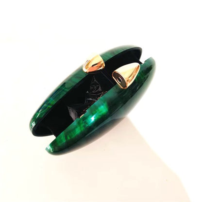 Vibrant green seashell clutch bag with a dreamy pearl acrylic finish, gold hasp closure, and chain strap – perfect for weddings, soirées, and beachside style by Montipi Australia