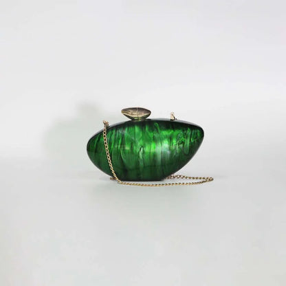 Vibrant green seashell clutch bag with a dreamy pearl acrylic finish, gold hasp closure, and chain strap – perfect for weddings, soirées, and beachside style by Montipi Australia
