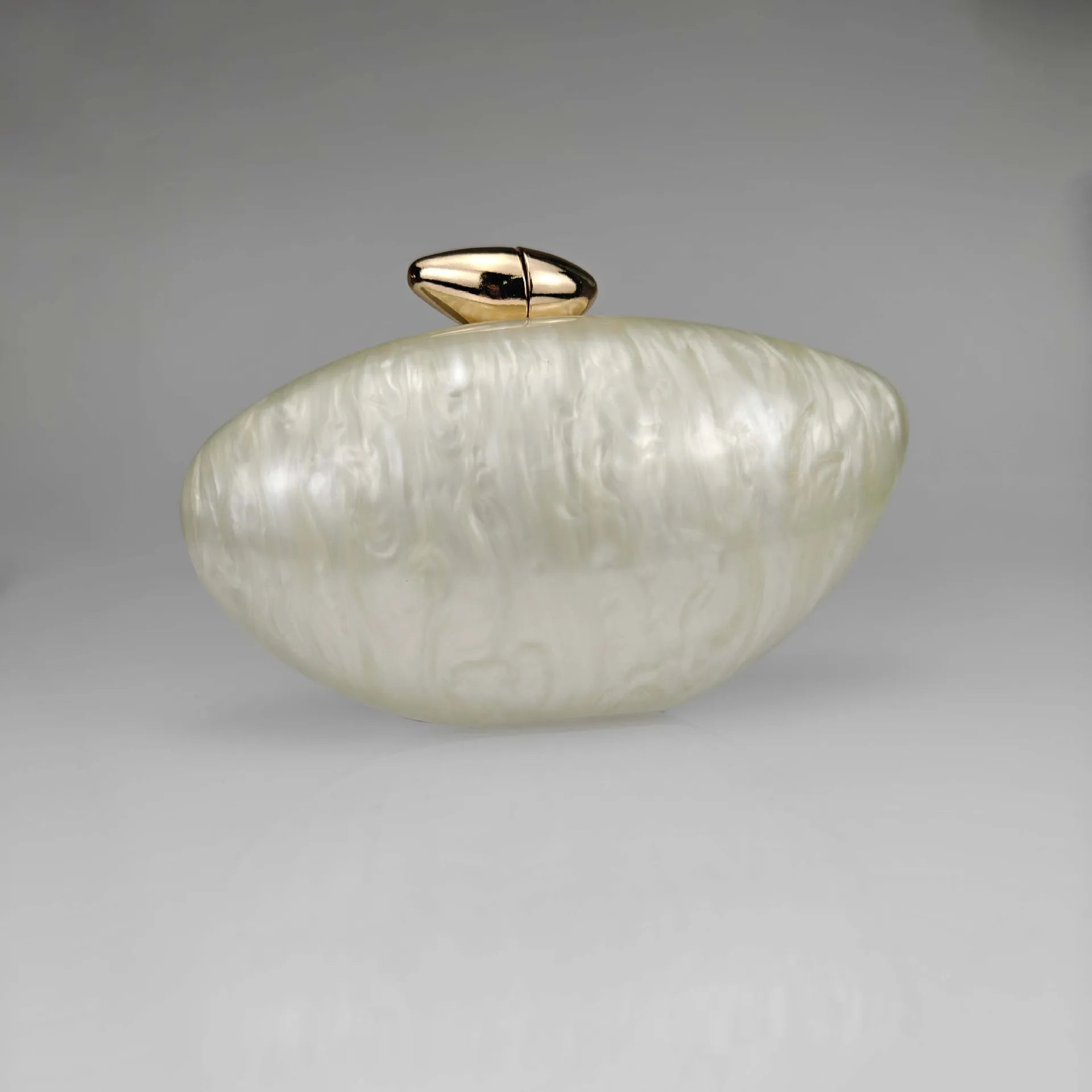 White pearl seashell clutch bag with a dreamy pearl acrylic finish, gold hasp closure, and chain strap – perfect for weddings, soirées, and beachside style by Montipi Australia