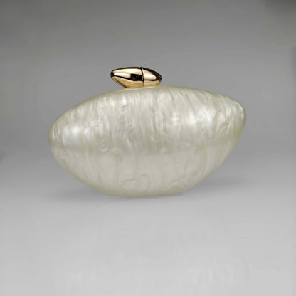 White pearl seashell clutch bag with a dreamy pearl acrylic finish, gold hasp closure, and chain strap – perfect for weddings, soirées, and beachside style by Montipi Australia
