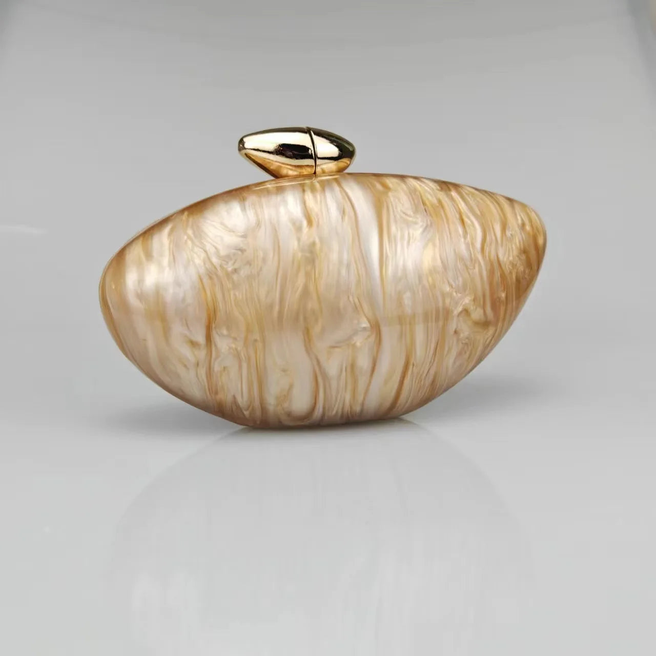 Gold seashell clutch bag with a dreamy pearl acrylic finish, gold hasp closure, and chain strap – perfect for weddings, soirées, and beachside style by Montipi Australia