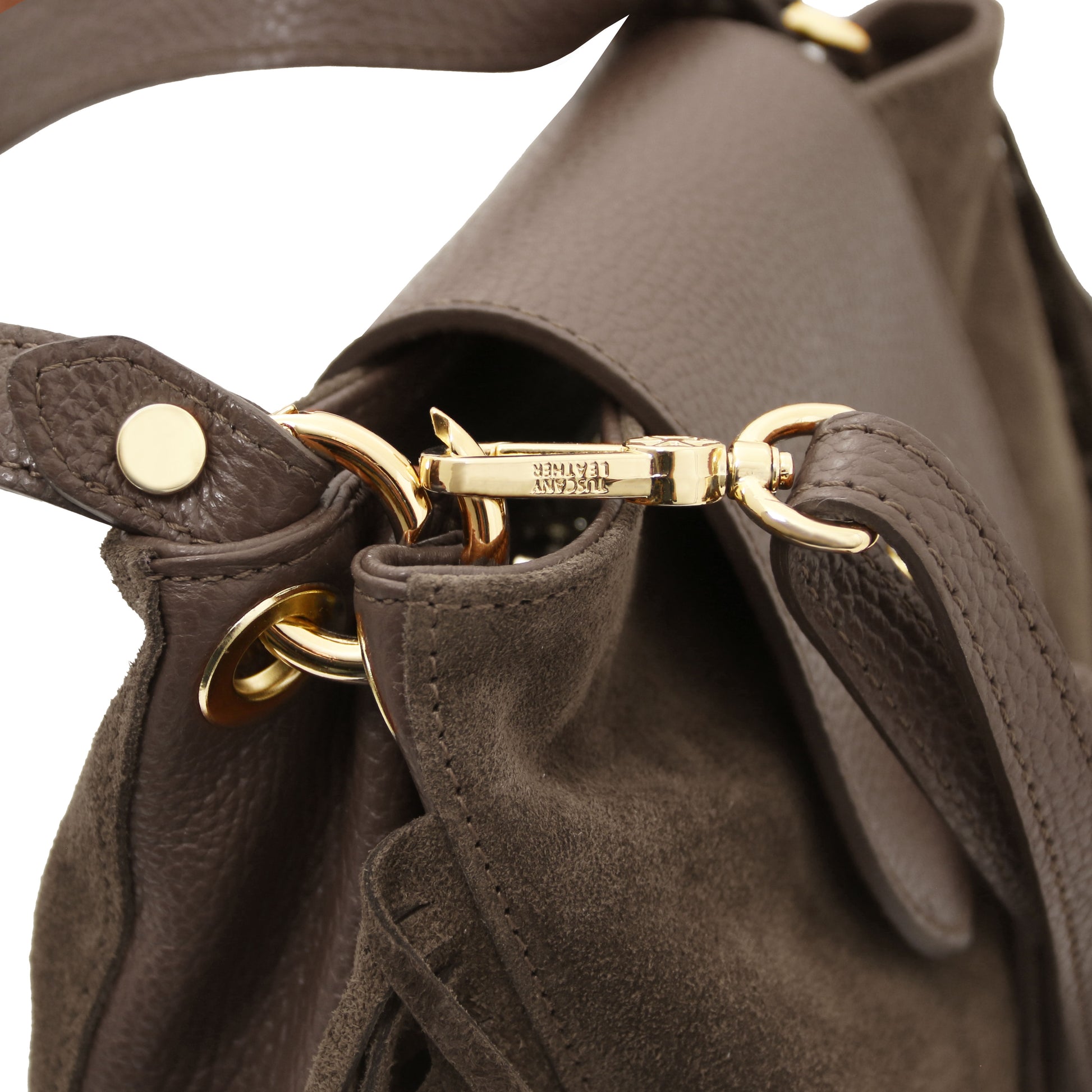 Close-up of the Nomad Dark Taupe Suede Leather Fringe Bag showing detachable adjustable leather strap, gold-tone hardware, and refined stitching by Montipi.