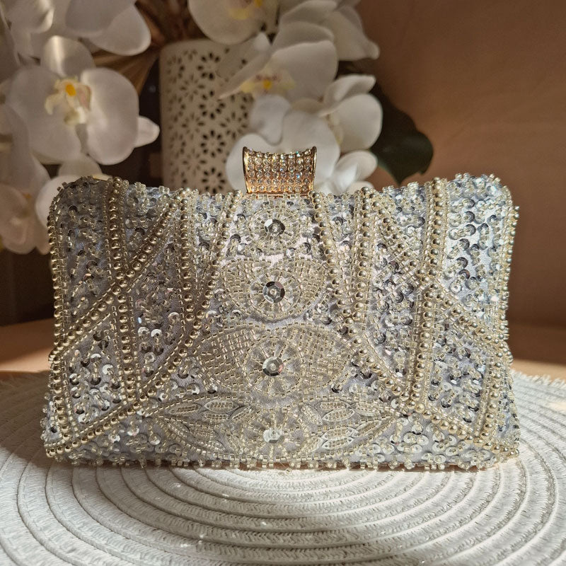 elegant Luxe-Silver-Pearl-Clutch-displayed in romantic floral wedding settings