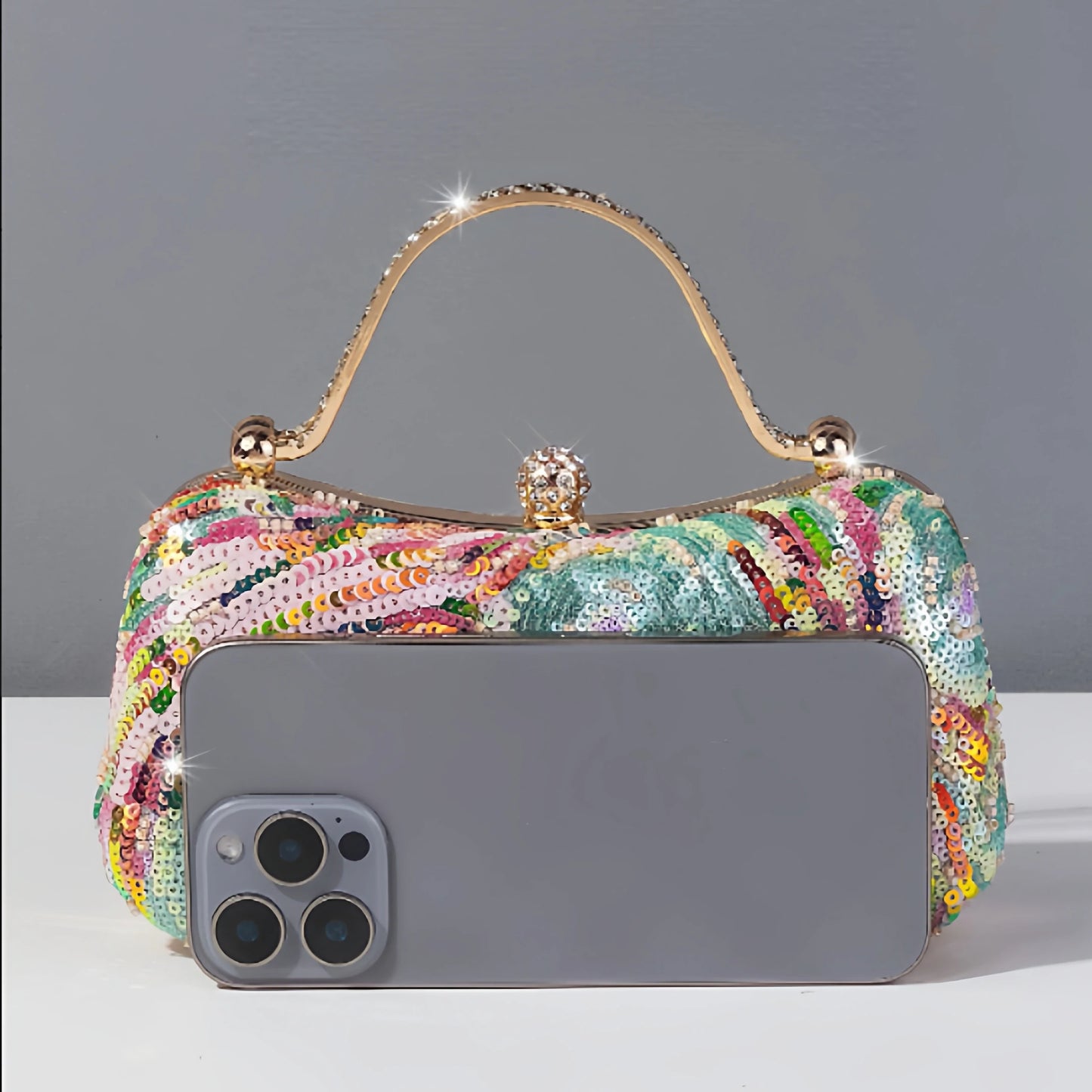 Sequin clutch bag in pastel tones fitting a large smart phone. A convenient evening bag with vintage glamour and whimsical elegance, perfect for weddings and celebrations for a boho chic style by Montipi