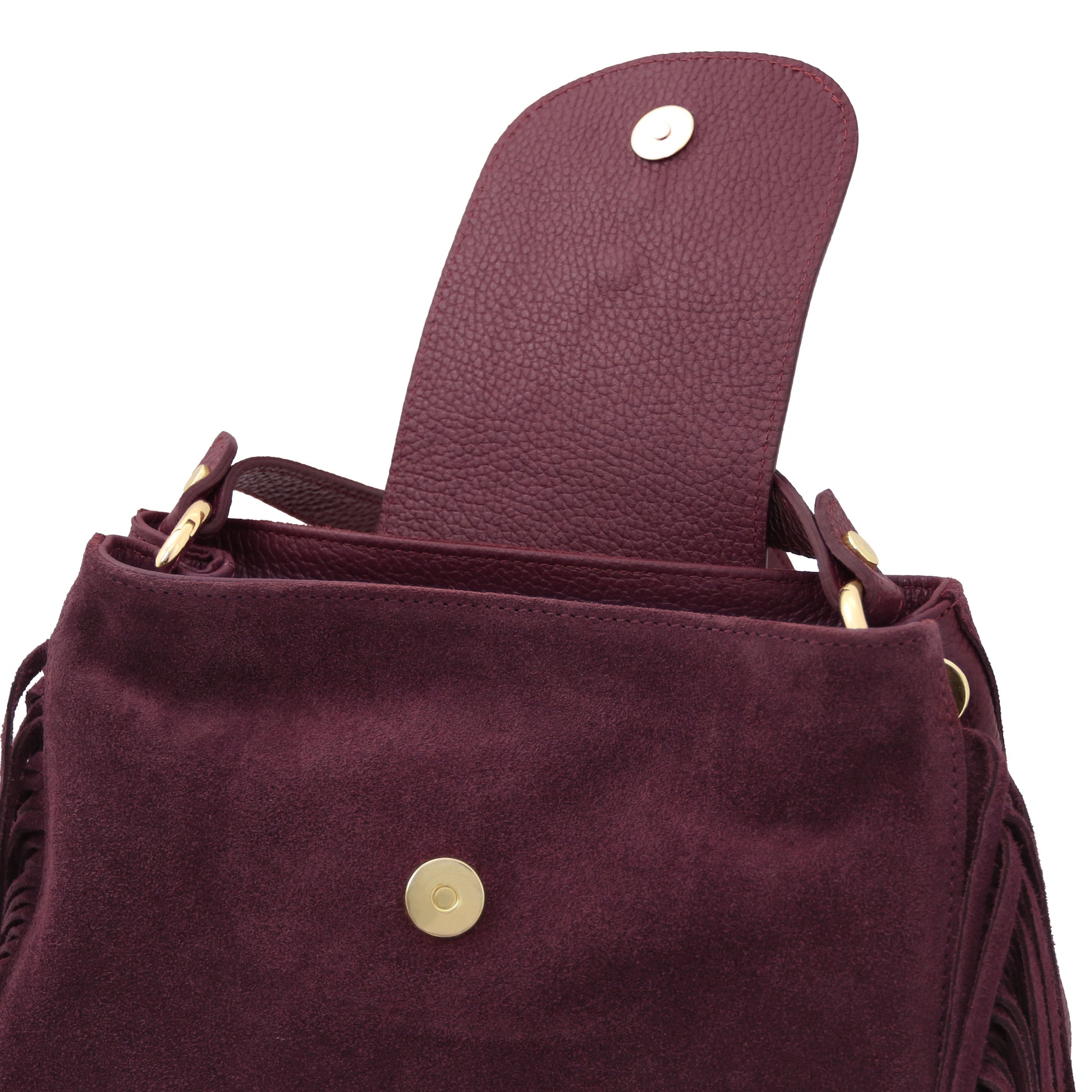 Interior view of the Nomad Burgundy Suede Leather Fringe Bag showing magnetic flap closure, soft beige lining, and refined finish by Montipi.