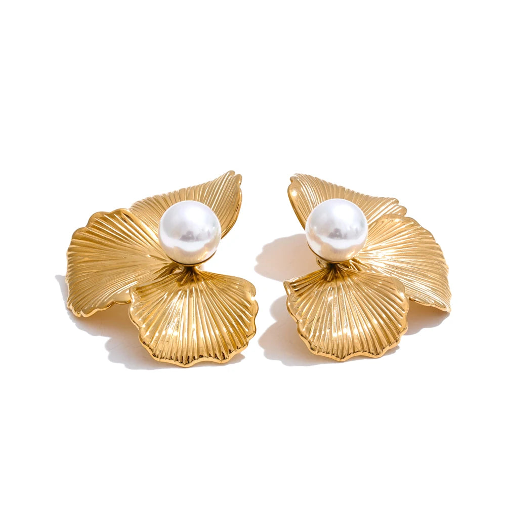 Gold orchid statement earrings with engraved petals and a centered pearl — elegant floral, couture-inspired by Montipi