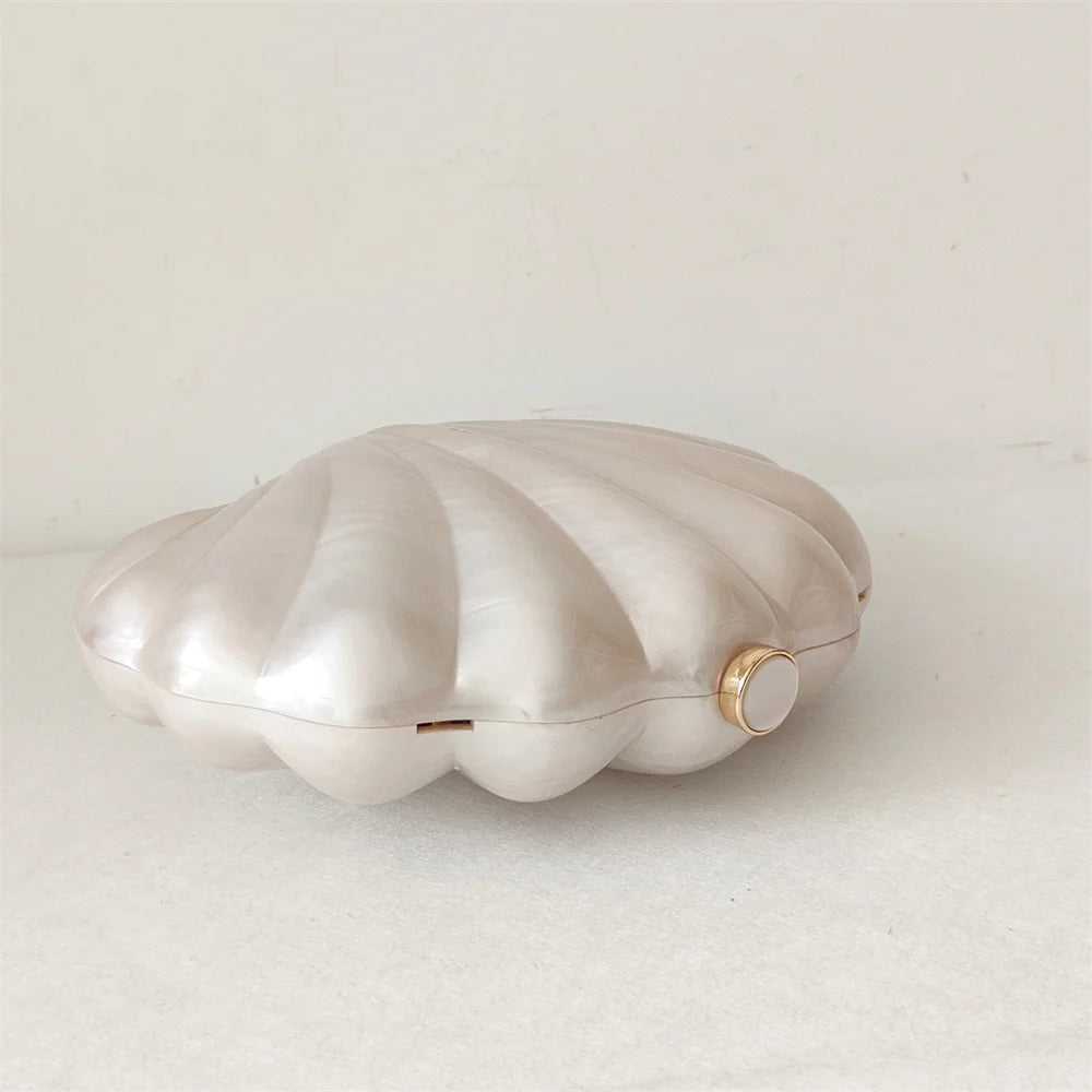 Original shell design Mermaid Pearl Shell Clutch Bag with elegant pearl hasp closure and gold tone hardware by Montipi Australia