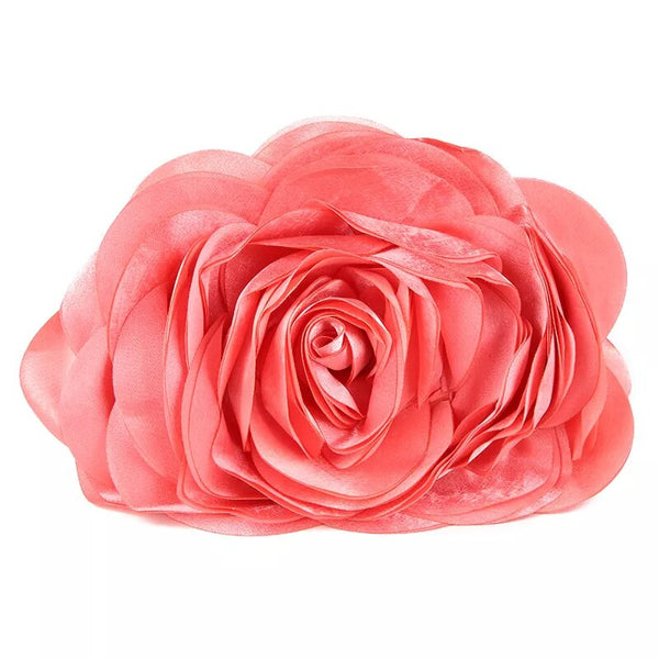 Close up front view of the Rose Chic Petal Clutch Bag. a delicate rose-shaped clutch bag with layered petal detailing in a soft, romantic hue. The elegant floral design mimics the texture of blooming petals, creating a timeless statement piece. Set against a refined backdrop, the clutch exudes femininity and sophistication, perfect for weddings, cocktail events, and special occasions. Rose Chic Petal Clutch Bag in rose pink by Montipi Australia