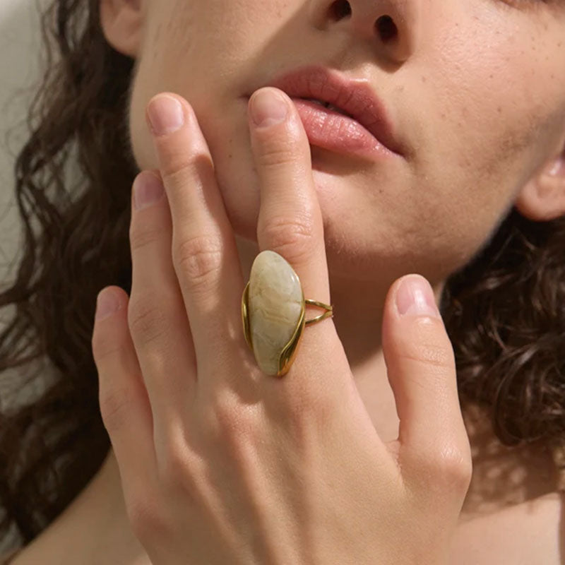 Model wearing Solara Gemstone Ring in Ivory – organic gold statement design