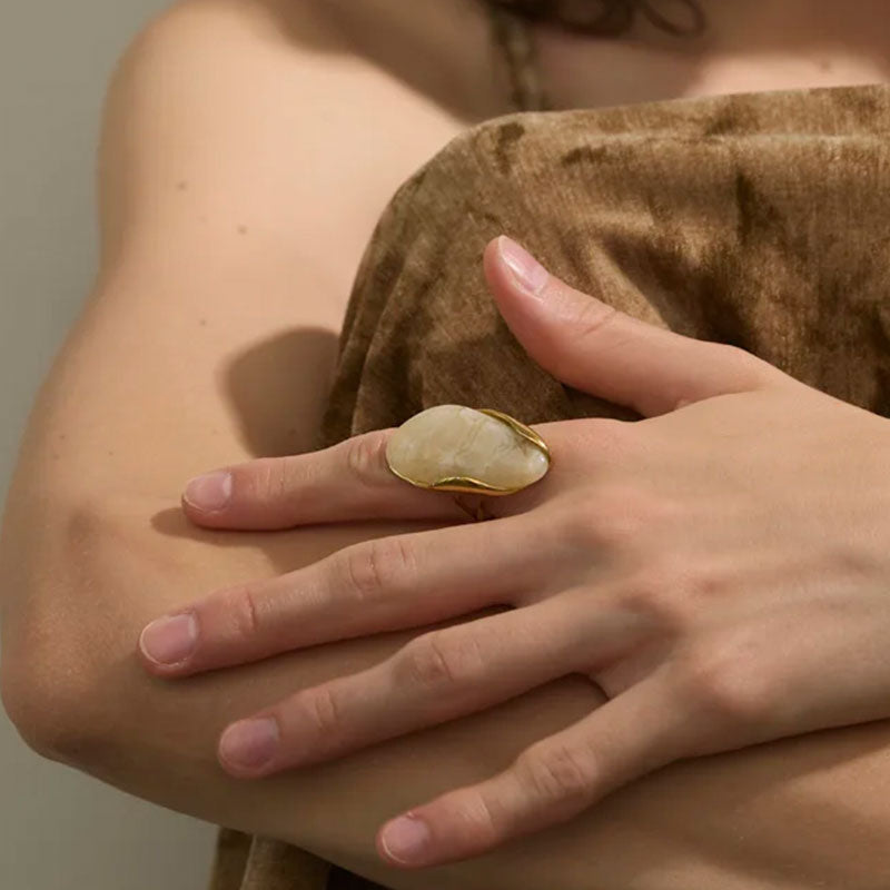 Model wearing Solara Gemstone Ring in Ivory – organic gold statement design