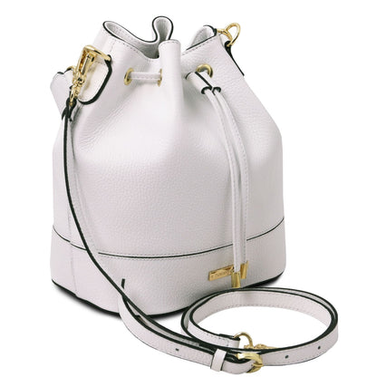 Angled view of the TL Leather Bucket Bag in white by Montipi Australia, showcasing its premium Italian pebbled leather, structured silhouette, and elegant drawstring closure with gold-tone hardware. A versatile handbag with a detachable top handle and adjustable shoulder strap, designed for everyday sophistication and effortless style.