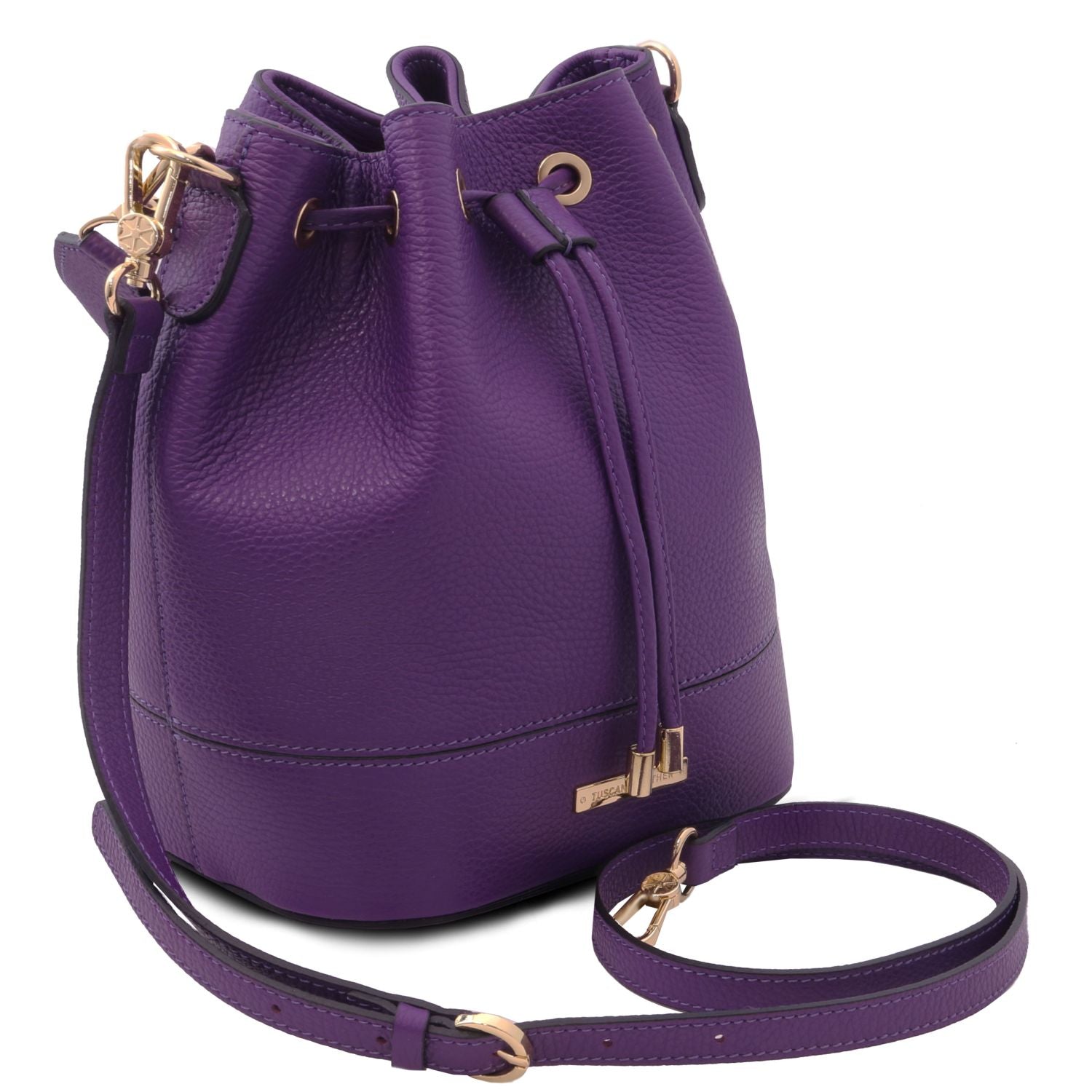 Angled view of the TL Leather Bucket Bag purple by Montipi Australia, showcasing its premium Italian pebbled leather, structured silhouette, and elegant drawstring closure with gold-tone hardware. A versatile handbag with a detachable top handle and adjustable shoulder strap, designed for everyday sophistication and effortless style.