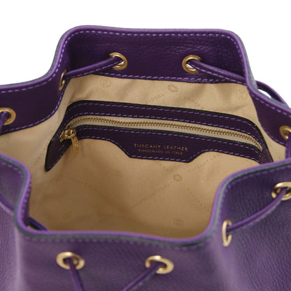 Interior view of the TL Leather Bucket Bag in purple by Montipi Australia, featuring a beige lining, spacious compartment, and secure internal zip pocket. Crafted from premium Italian pebbled leather with gold-tone hardware, this chic bucket bag blends elegance with everyday practicality.