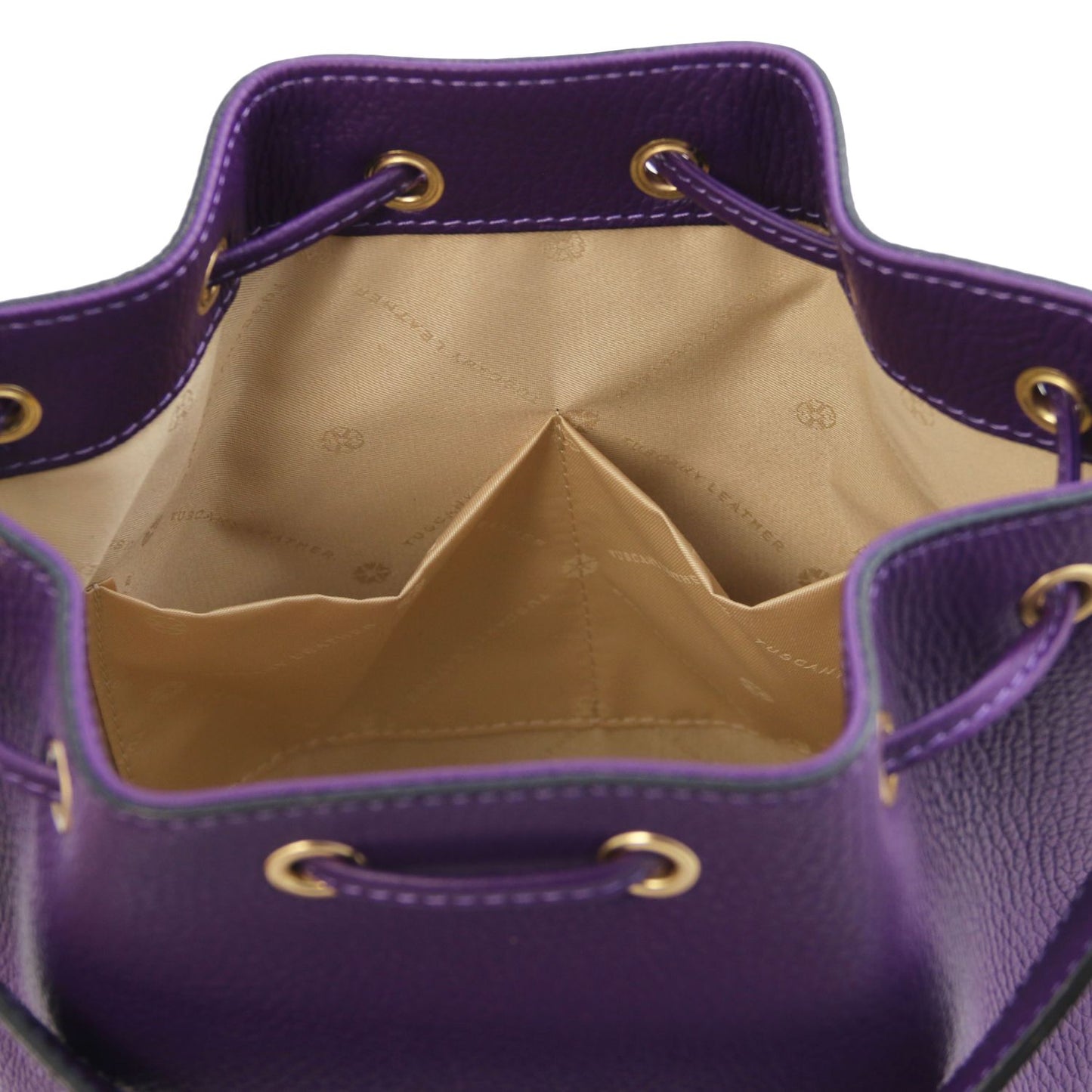 Interior view of the TL Leather Bucket Bag in purple by Montipi Australia, showcasing the beige lining, dual slide pockets, and spacious compartment for effortless organization. Crafted from premium Italian pebbled leather with gold-tone hardware, this elegant bucket bag combines sophistication with practicality