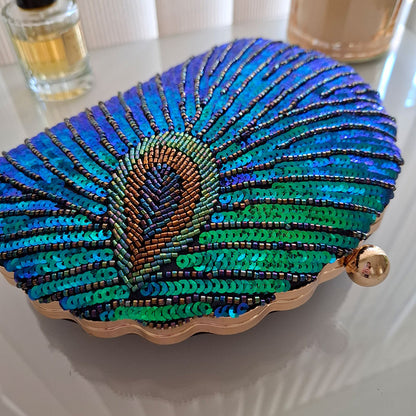 Teal-Peacock-Sequin-Clutch-Bag-Close-Up-Sequin-Details-in-chic-background-with-perfume-and-candle-by-MONTIPI Australia