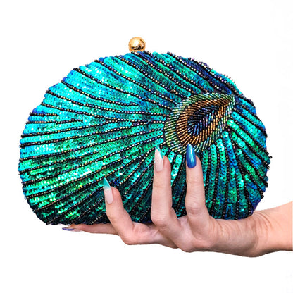 Teal Sequin Peacock Clutch held by hand with matching Teal Peacock nail art design, elegant whimsical eclectic chic style by Montipi Australia