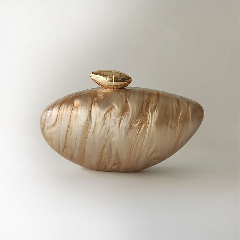 elegant gold clutch in shell shape with gold hasp closure for the perfect beach wedding or coastal chic look by Montipi 