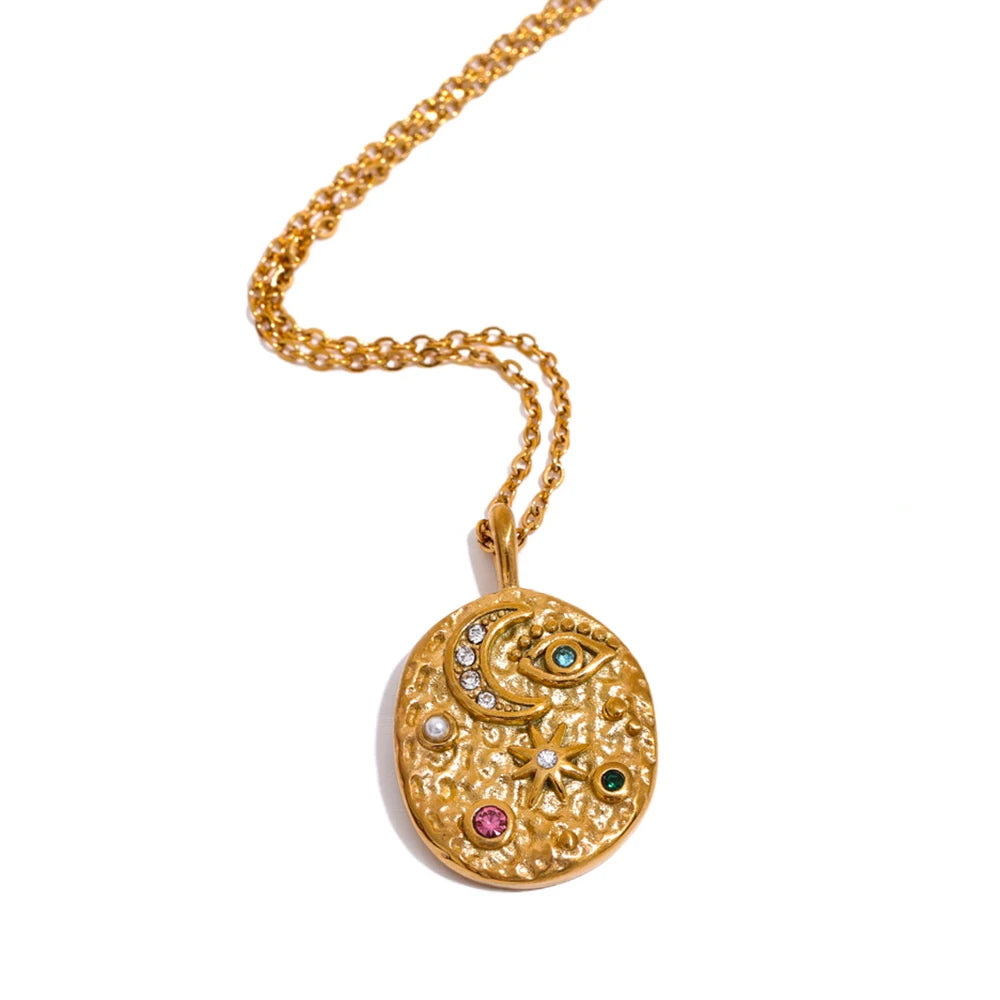 Gold medallion pendant with moon and star engravings – Lunara Celestial Medallion Necklace by Montipi.