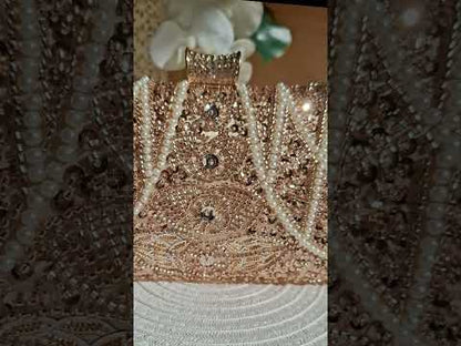 a gorgeous evening rose gold bag for weddings and special occasions Close up on the elegant feminine and timeless Romantic Rose Gold Pearl Clutch Bag by Montipi Australia 